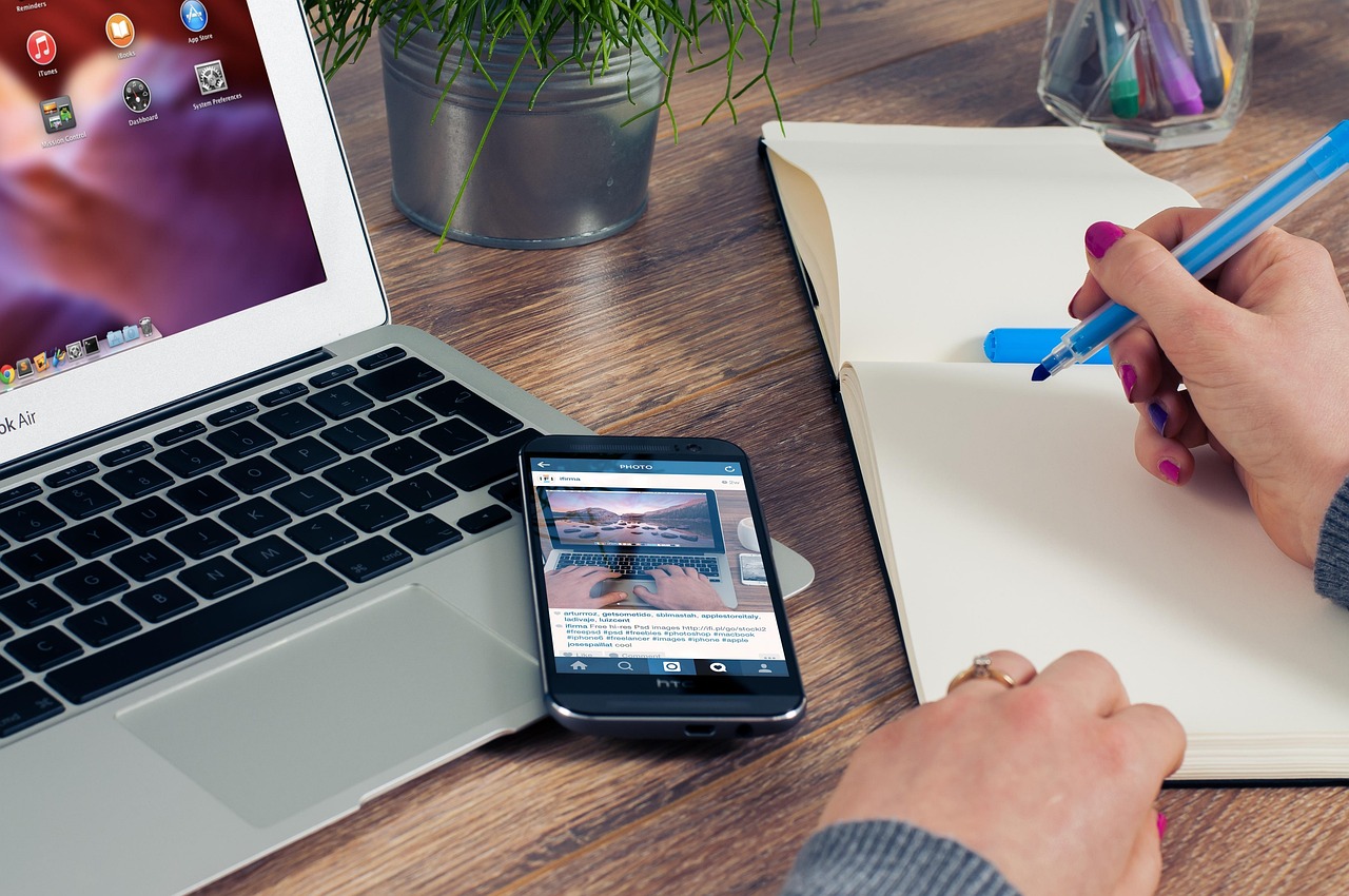 Smartphone and laptop on desk